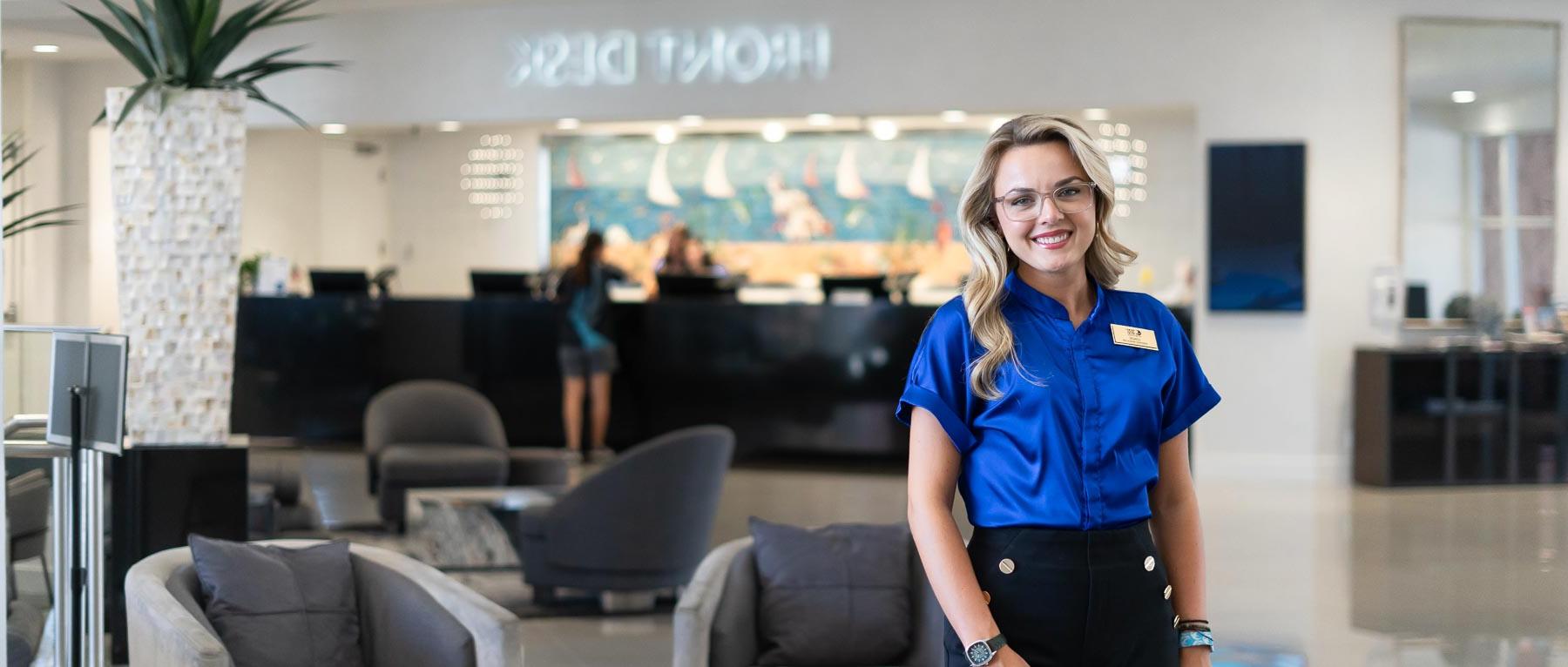 Lenzie Richardson, who graduated in hospitality and tourism management from the University of South Alabama, at the Perdido Beach Resort near the front desk, where she is an assistant manager.